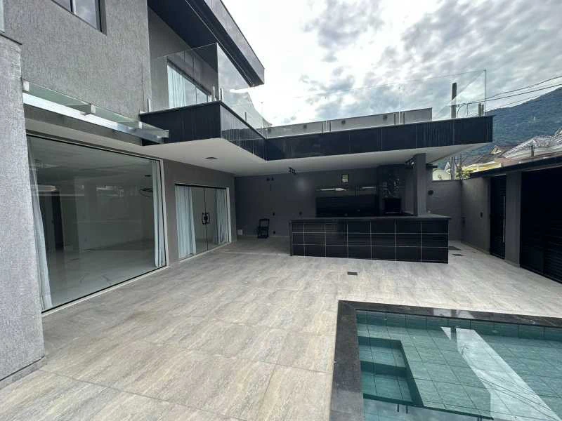 Casa com 4 suítes e 292 m², com 3 vagas e churrasqueira — photo 3
