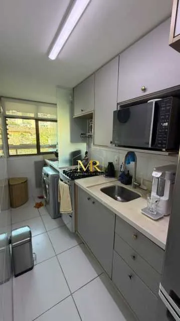 2-bedroom apartment in a building with a pool — photo 2