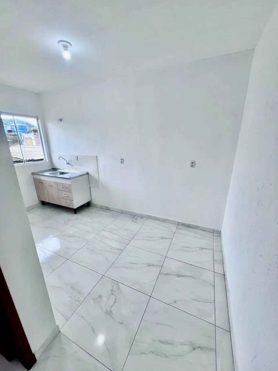 Unfurnished apartment with a compact kitchenette and 1 bedroom