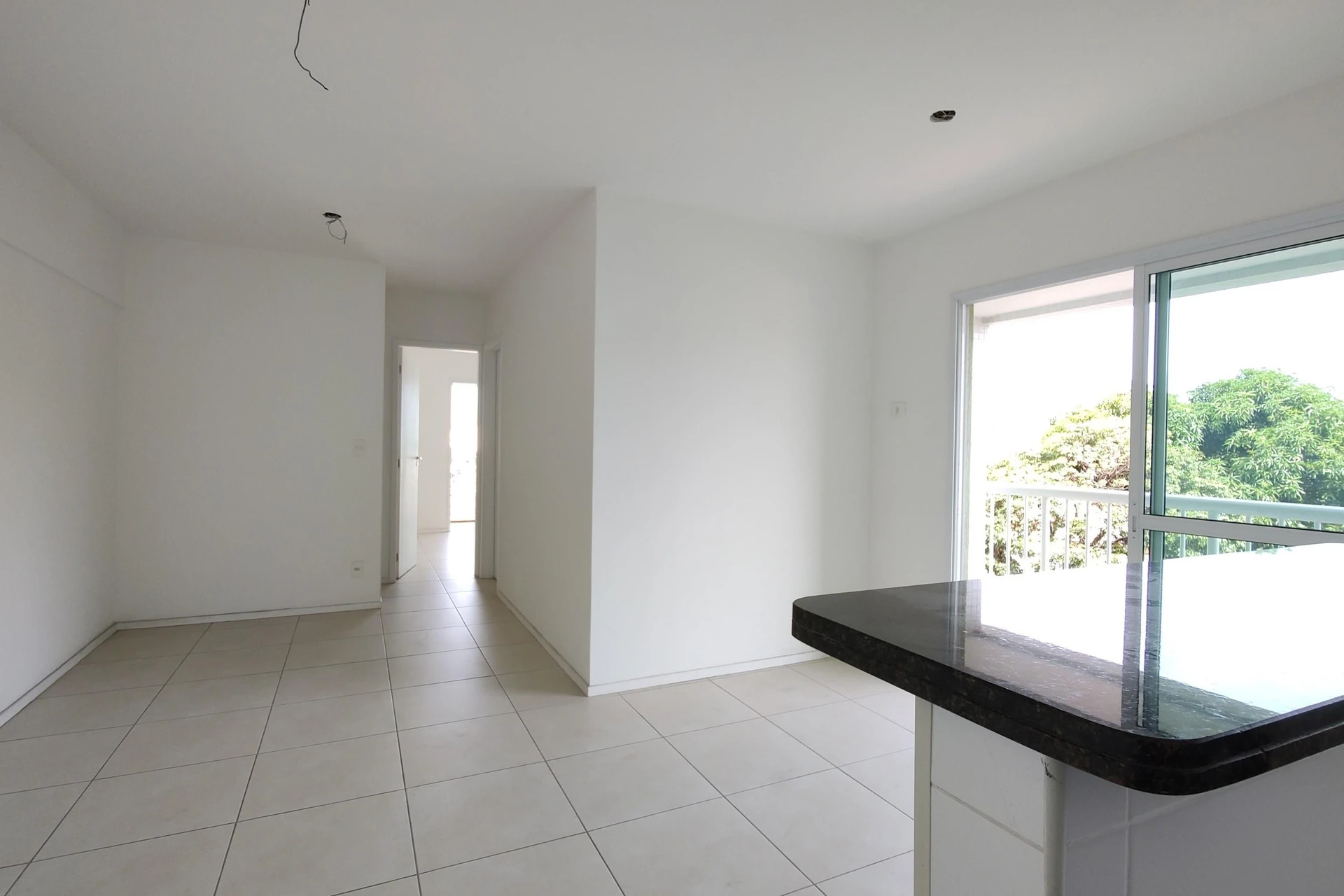 Unfurnished apartment with an open-plan kitchen and balcony — photo 8