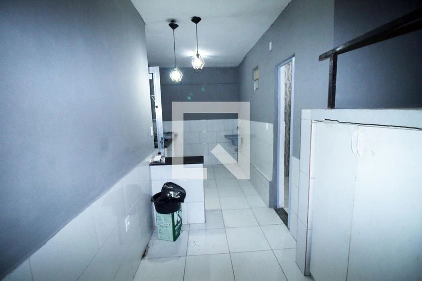 Unfurnished studio with gas stove and laundry area — photo 10