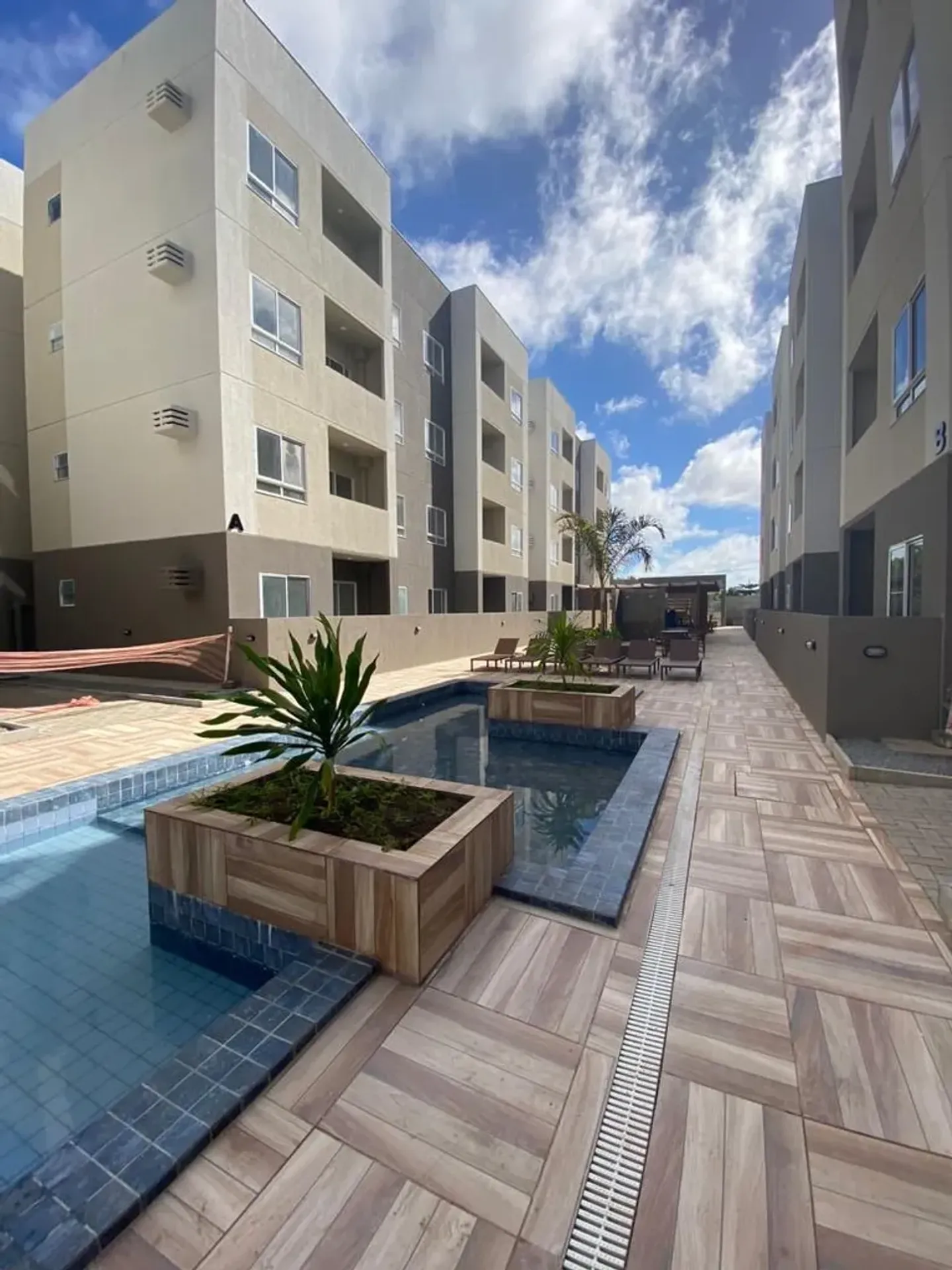 2-bedroom apartment in a building with a pool — photo 3