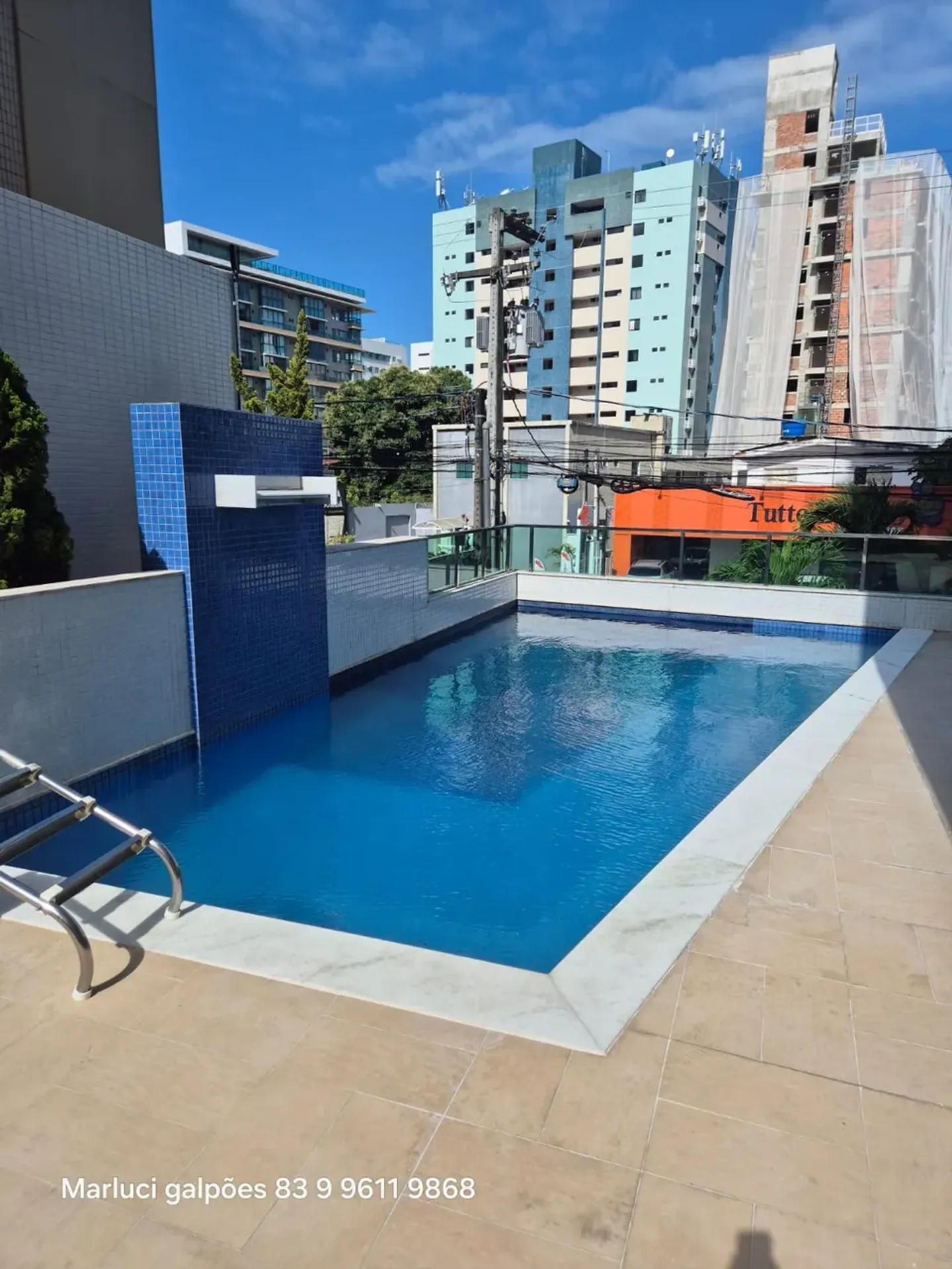2-bedroom apartment in a building with a pool — photo 7
