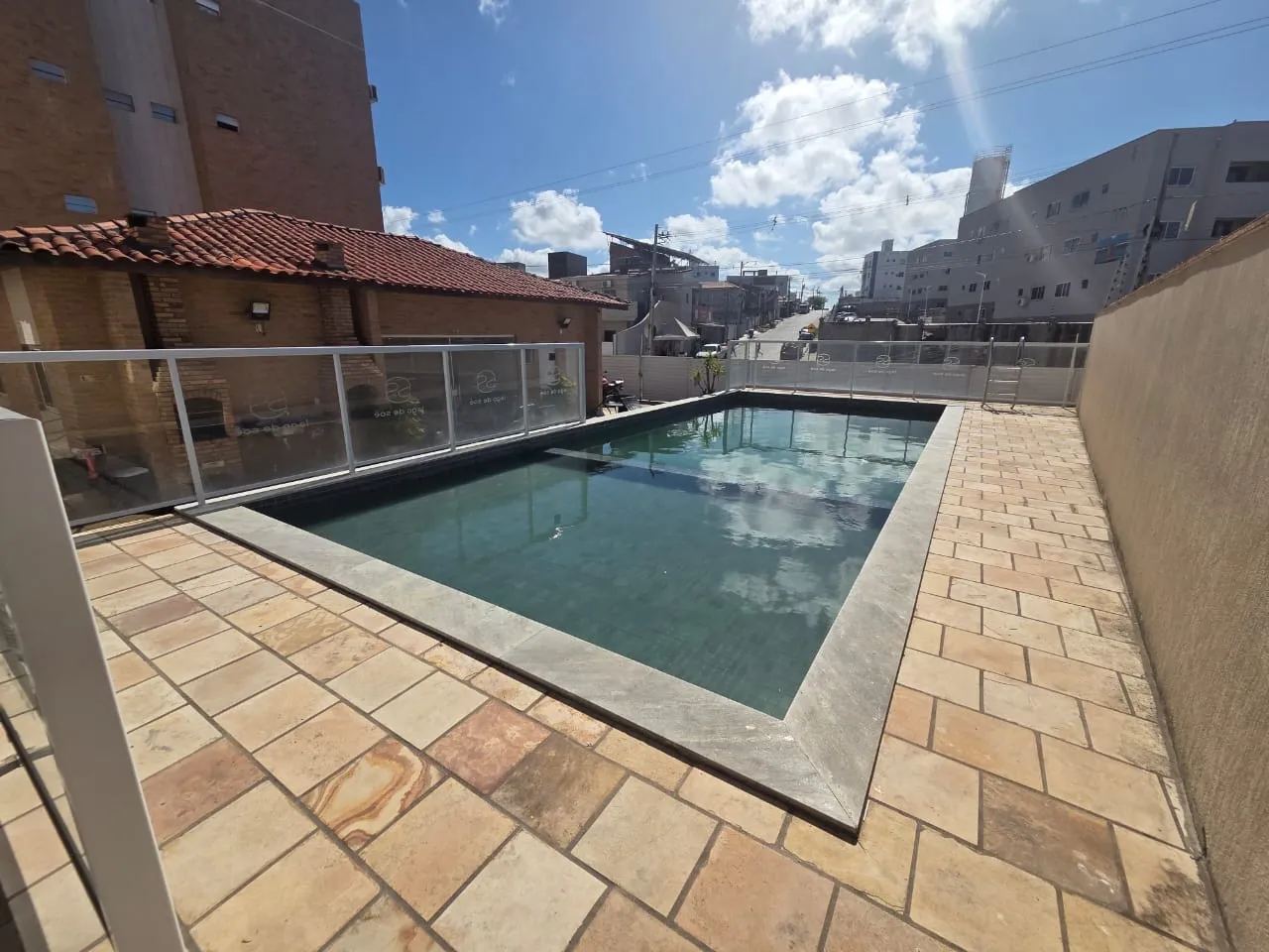 2-bedroom apartment in a building with a pool — photo 5