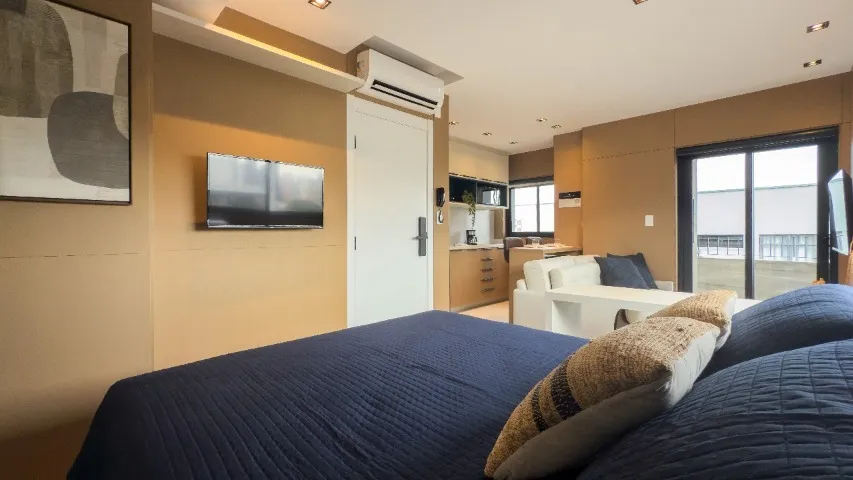 Furnished studio with open-plan kitchen and balcony — photo 13