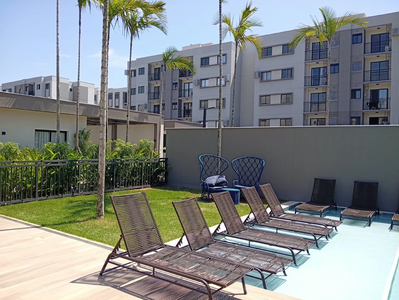 2-bedroom apartment in a building with a pool — photo 9