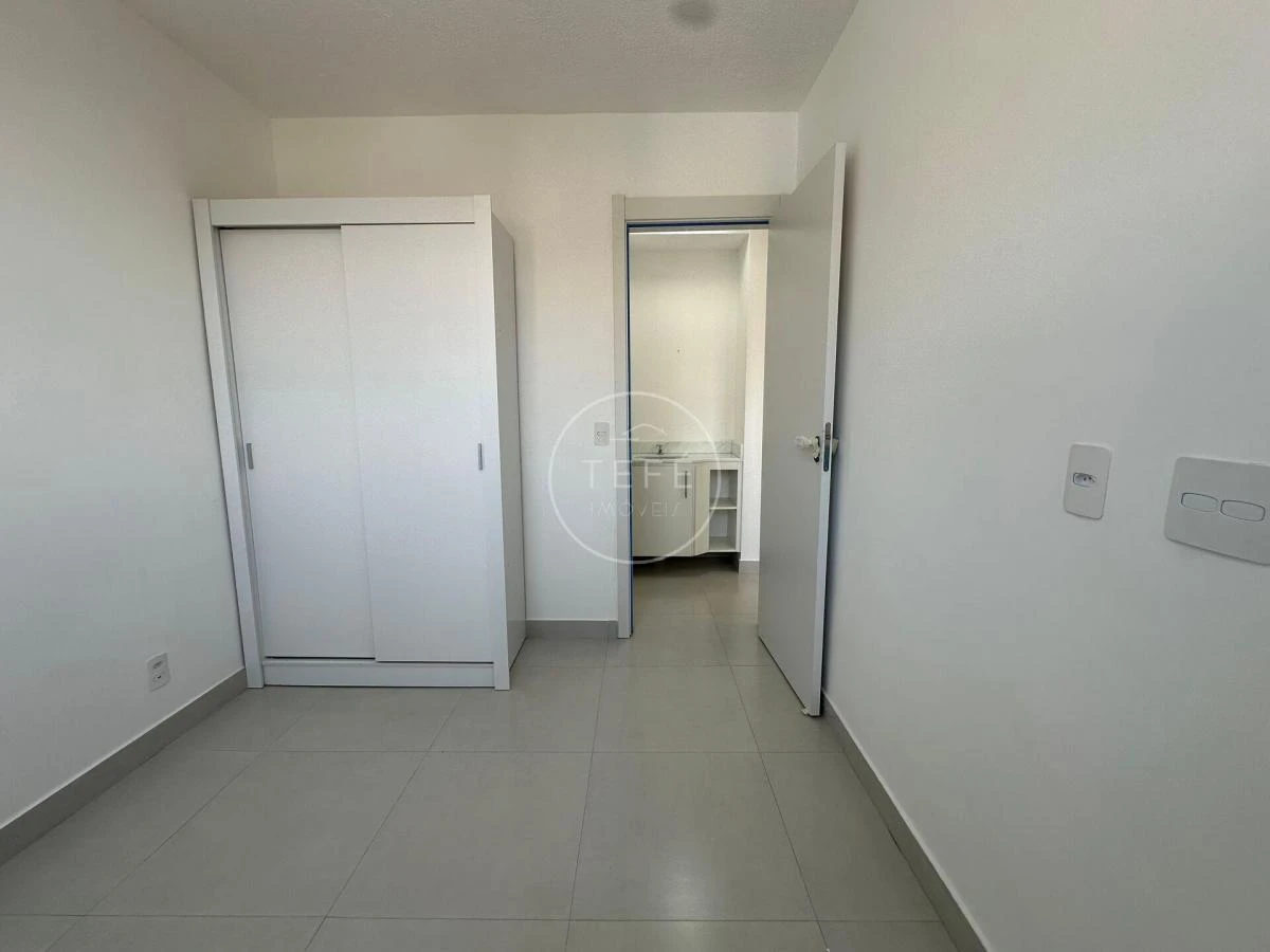 One-bedroom apartment in a building with a pool — photo 9