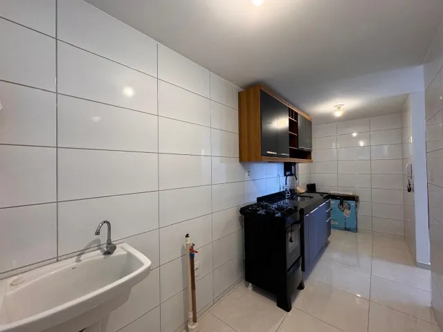 2-bedroom apartment in a building with a pool — photo 12