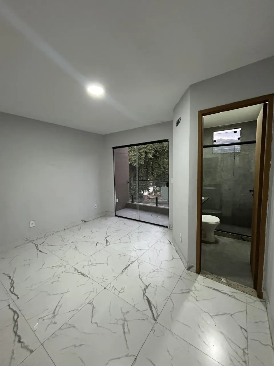 Unfurnished apartment with open-plan kitchen and balcony — photo 3