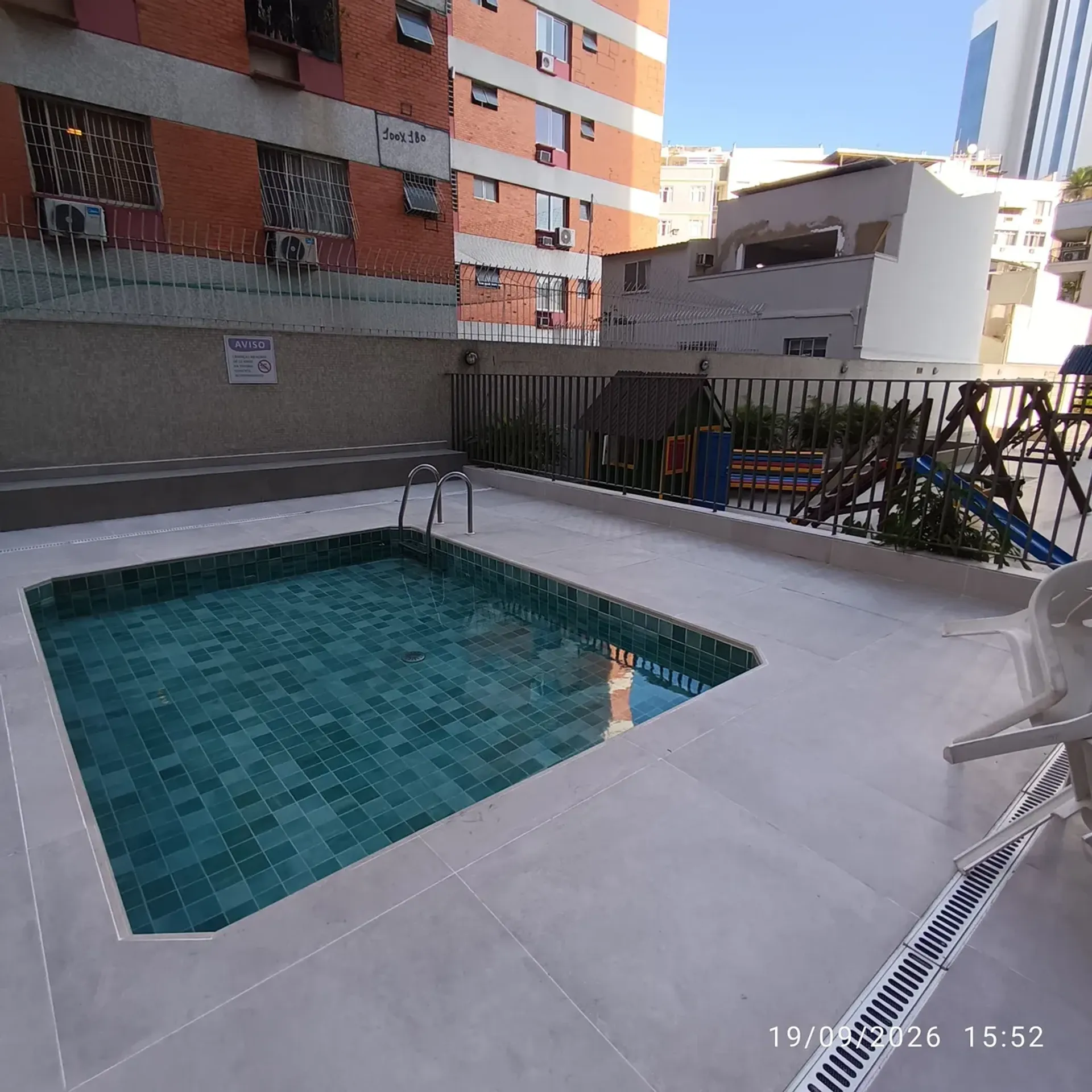 2-bedroom apartment in a building with a pool — photo 14