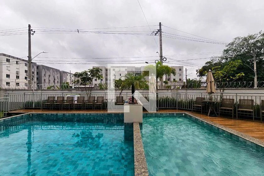 2-bedroom apartment in a building with a pool — photo 17