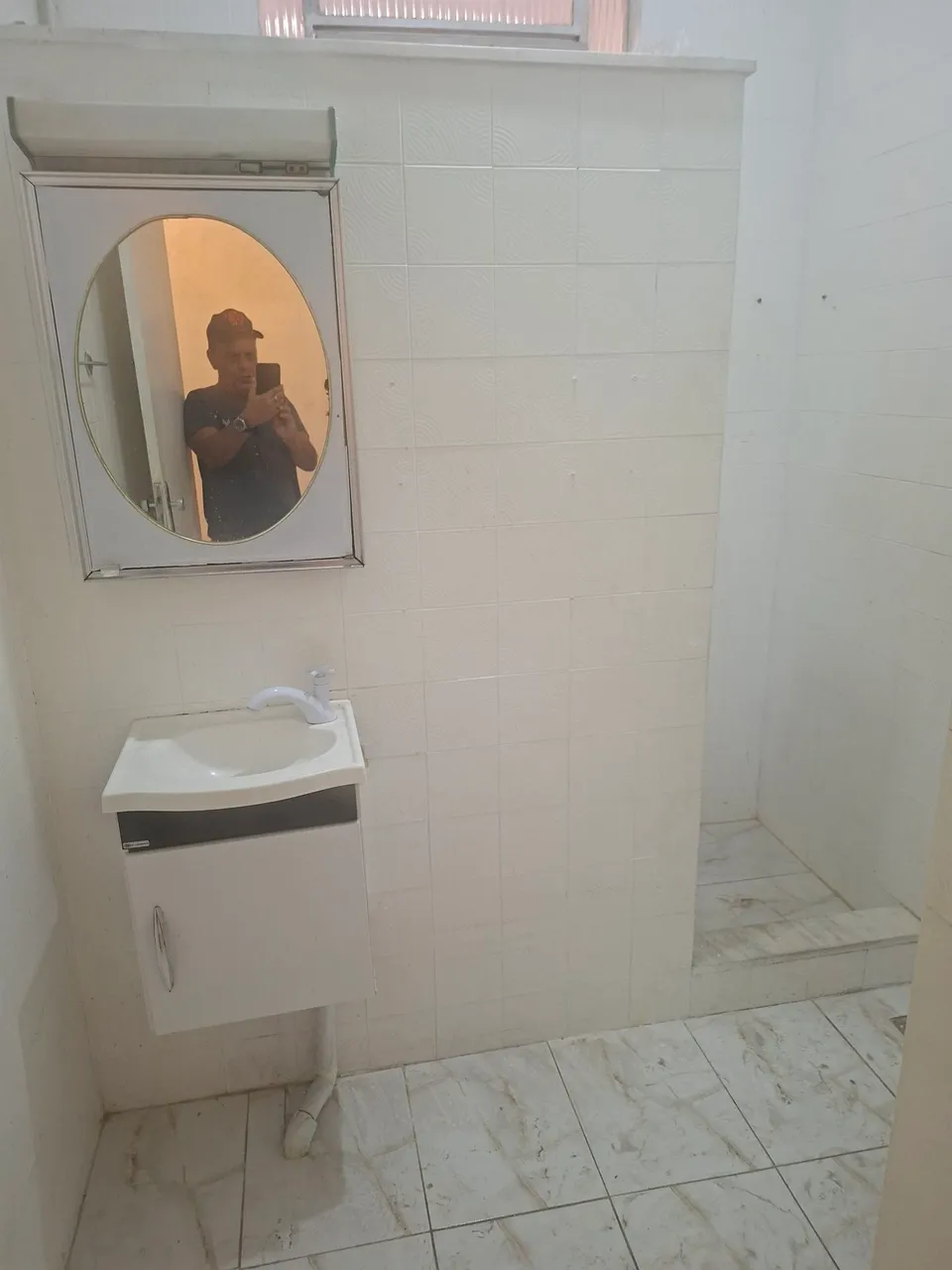 House with an electric shower and laundry area — photo 11