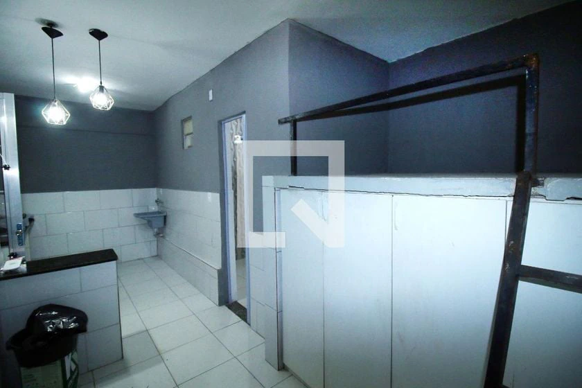 Unfurnished studio with gas stove and laundry area — photo 9