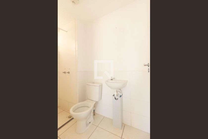 Minimal-style 2-bedroom apartment with ceramic floors — photo 17