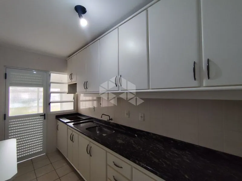 2-bedroom apartment in a building with a pool — photo 2
