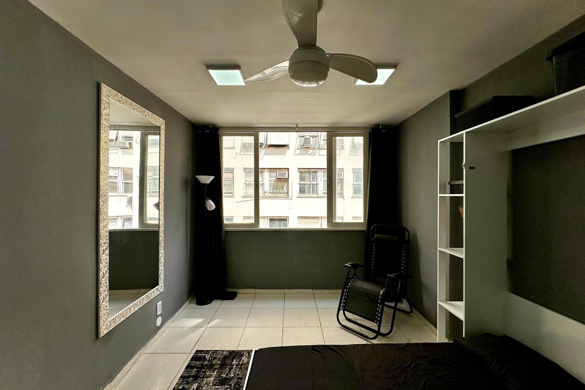 Furnished studio with 1 bedroom and a glass shower — photo 8