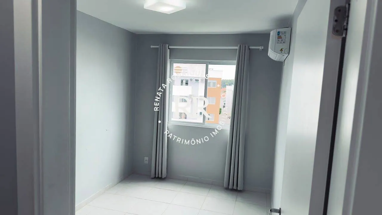 2-bedroom apartment in a building with a tennis court