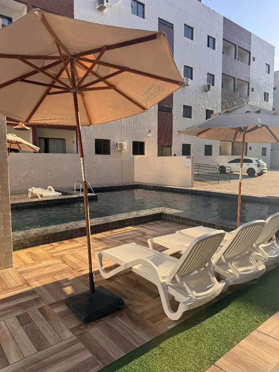 2-bedroom apartment in a building with a pool — photo 3