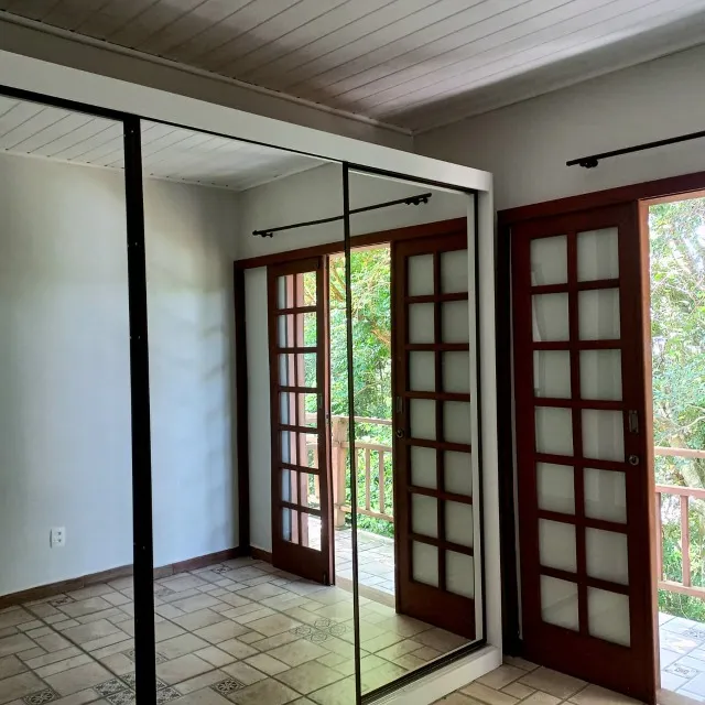 Unfurnished townhouse with a balcony and laundry area