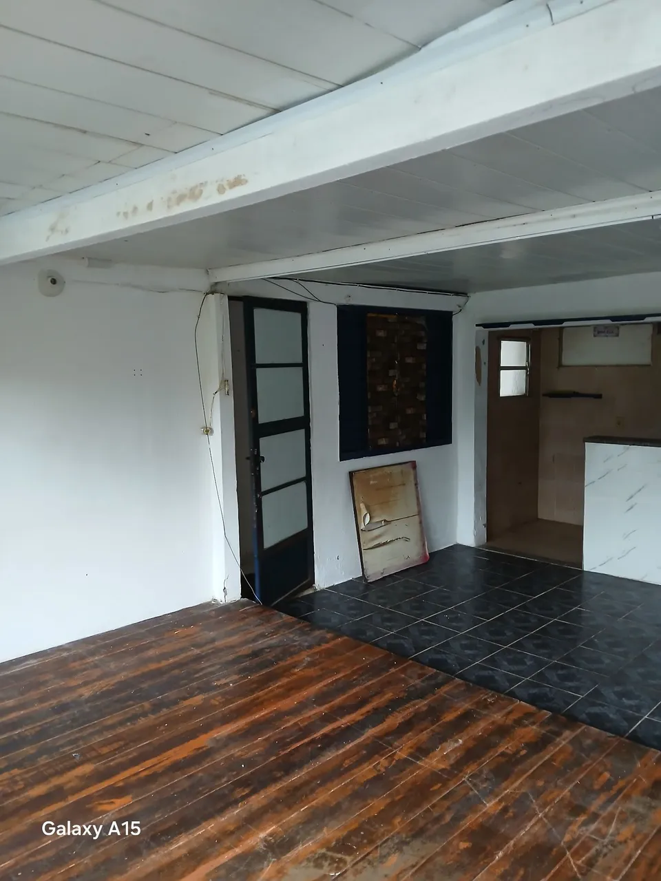Unfurnished studio with 1 bedroom and a compact kitchenette
