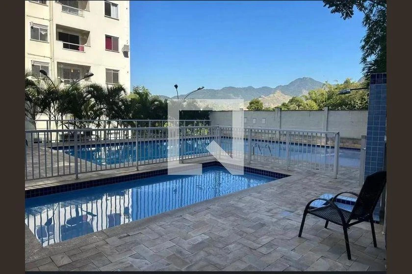 2-bedroom apartment in a building with a pool — photo 33