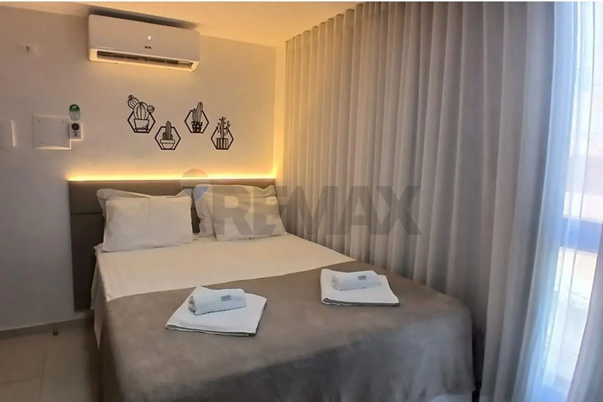 One-bedroom apartment in a building with a pool — photo 18