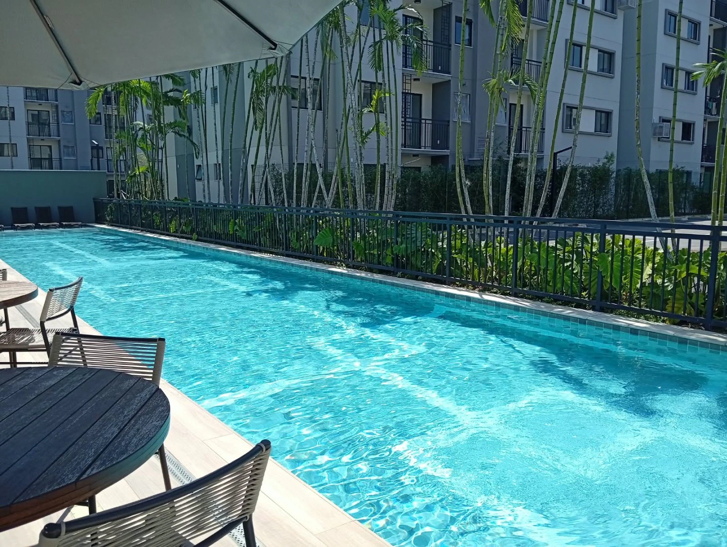 2-bedroom apartment in a building with a pool — photo 5