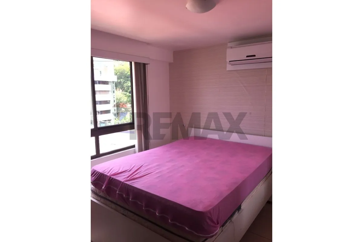 One-bedroom apartment in a building with a pool — photo 3