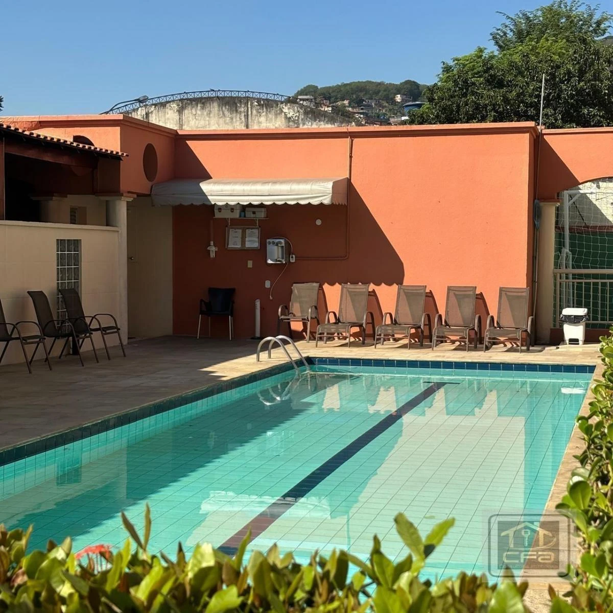 2-bedroom apartment in a building with a pool — photo 25