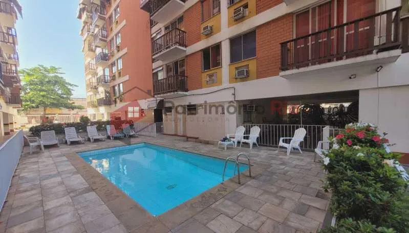 2-bedroom apartment in a building with a pool — photo 15