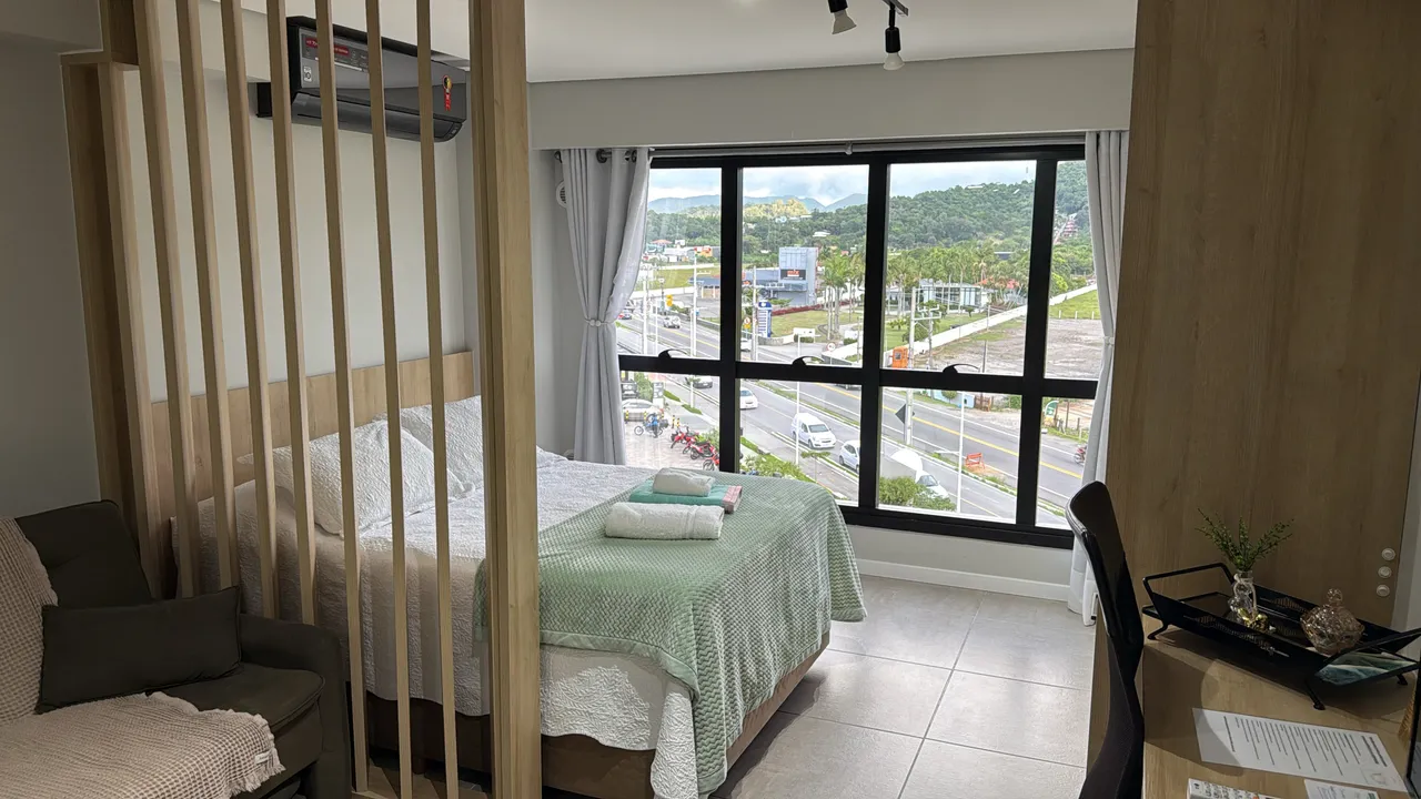 Furnished studio with open-plan kitchen and parking