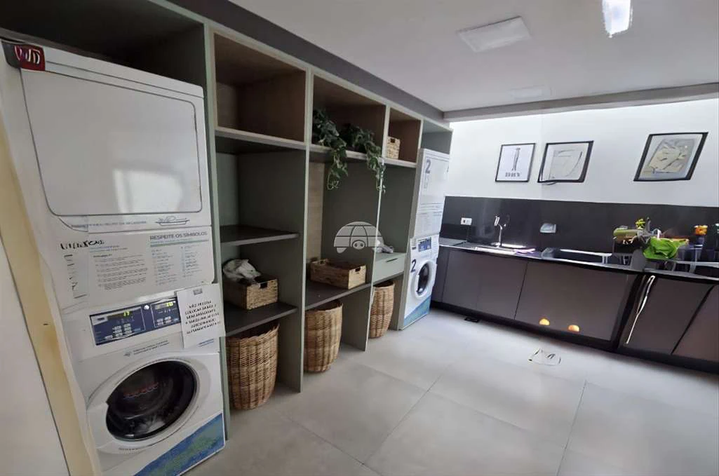 1-bedroom apartment with a laundry setup — photo 4