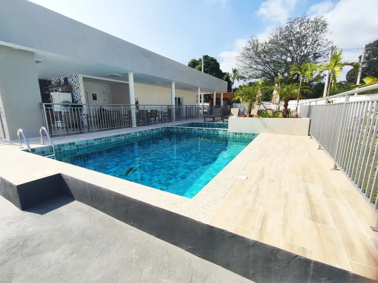 2-bedroom apartment in a building with a pool — photo 5