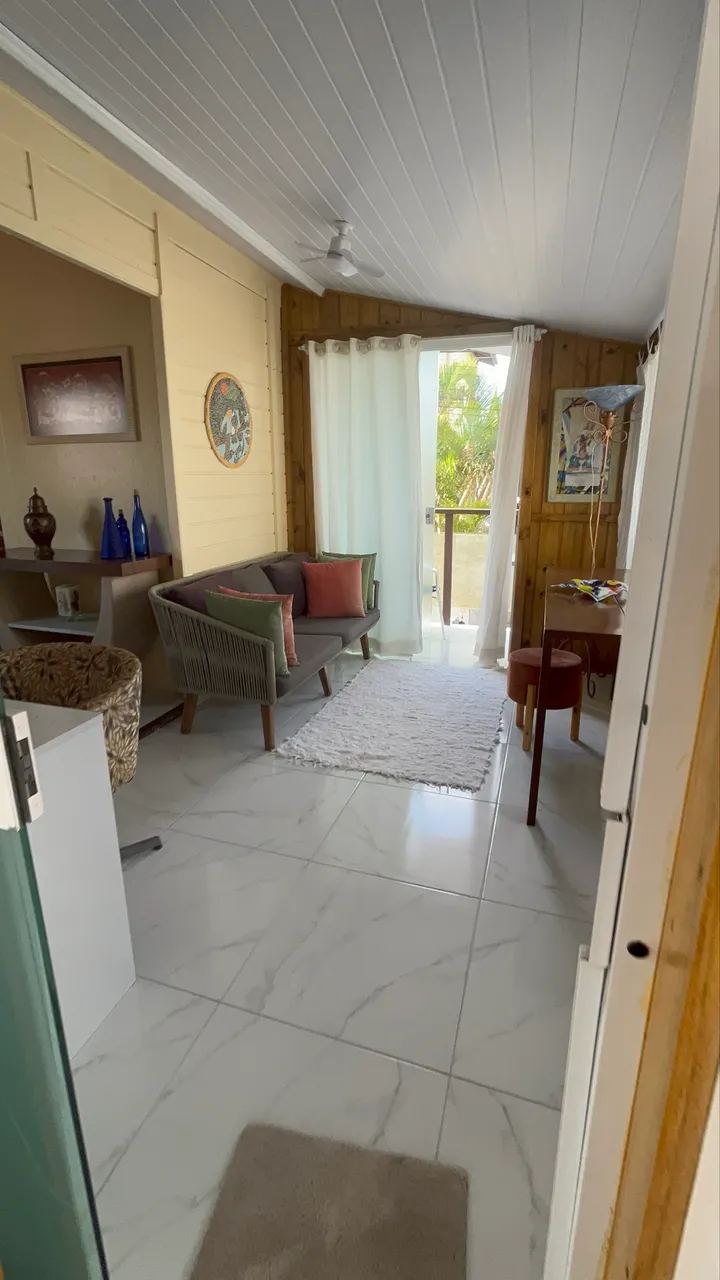 Furnished studio with a laundry area and washing machine