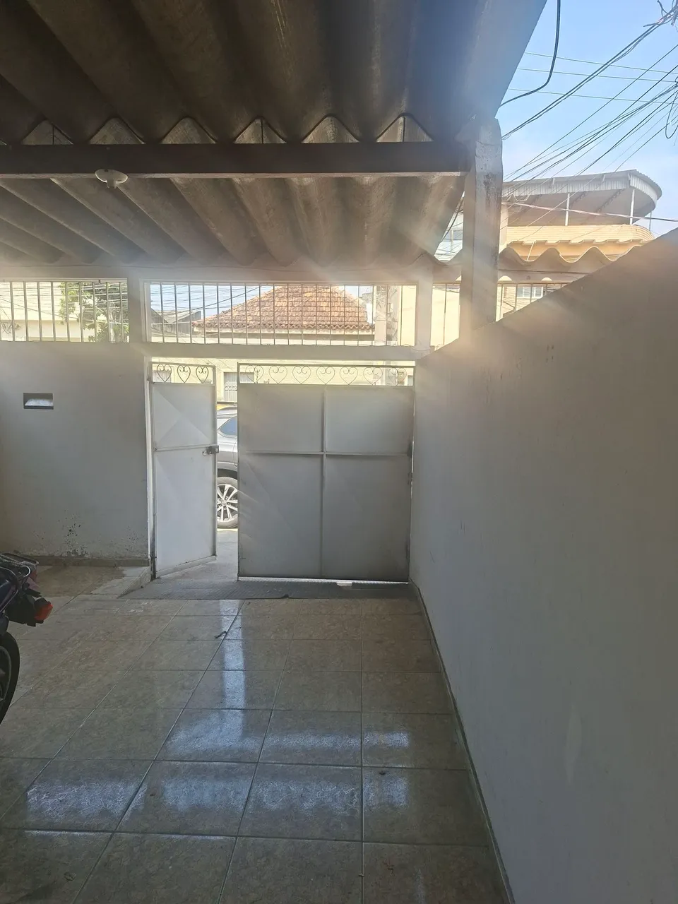 House with an electric shower and laundry area — photo 4
