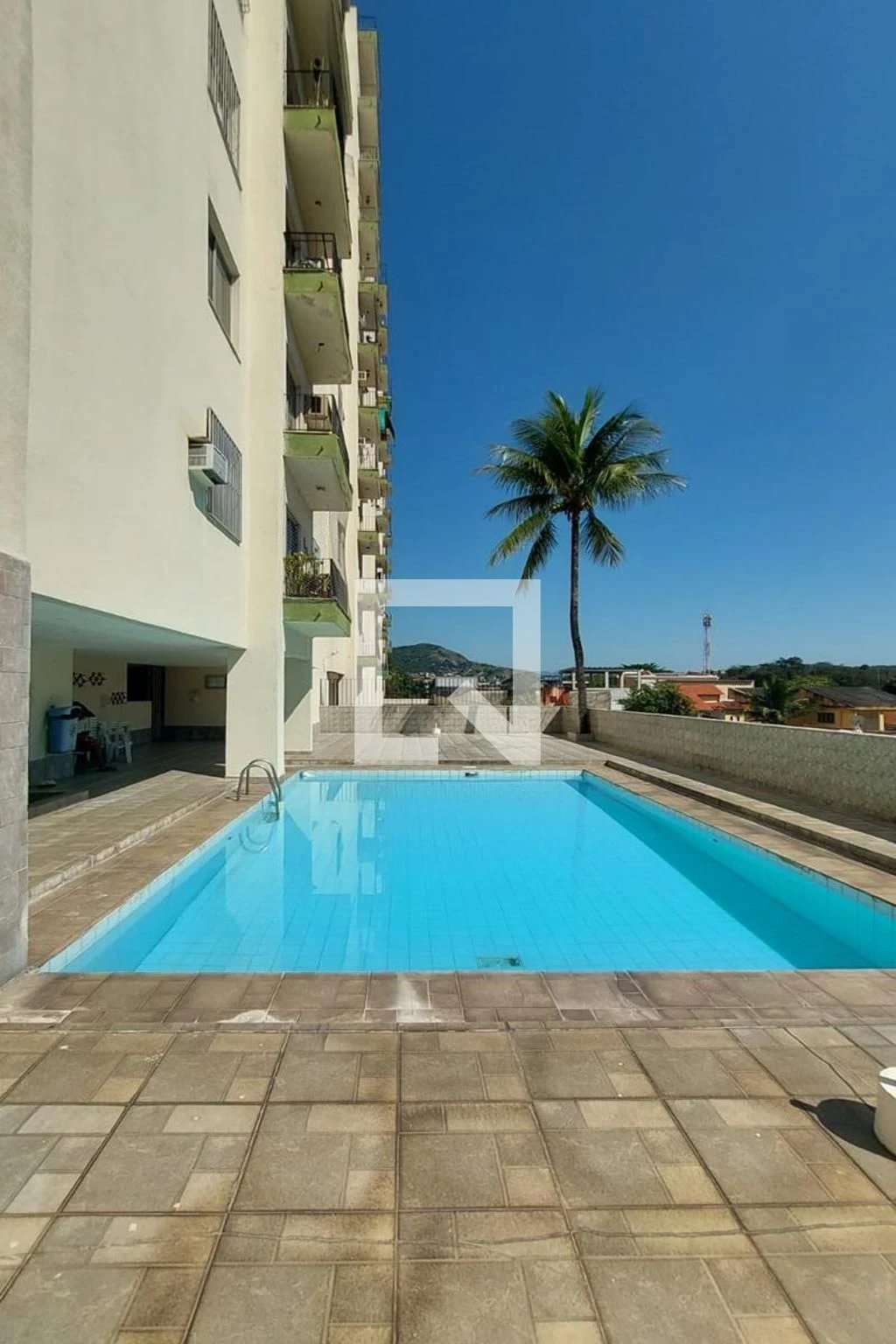 2-bedroom apartment in a building with a pool — photo 12