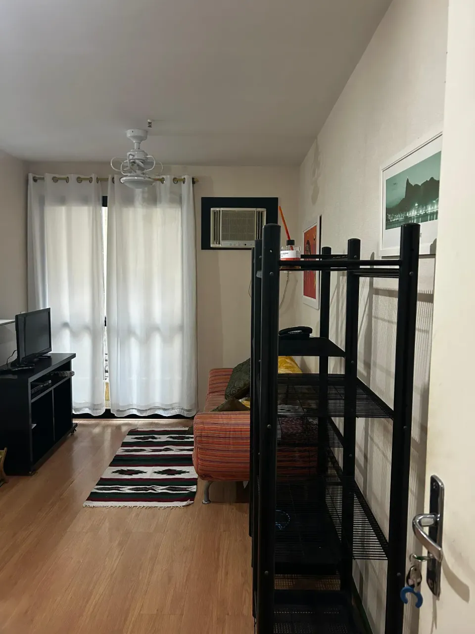 One-bedroom apartment with wood or laminate floors — photo 11