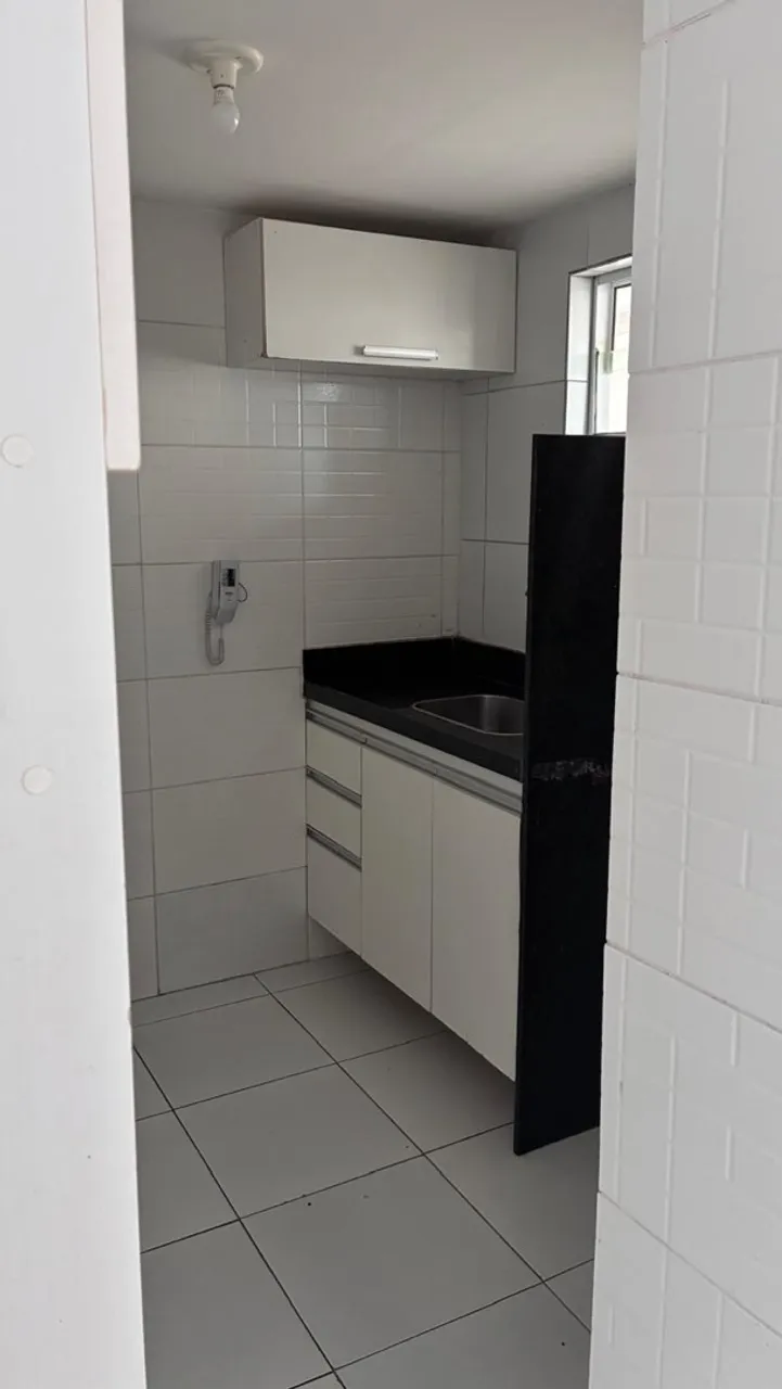 2-bedroom apartment in a building with a pool — photo 12