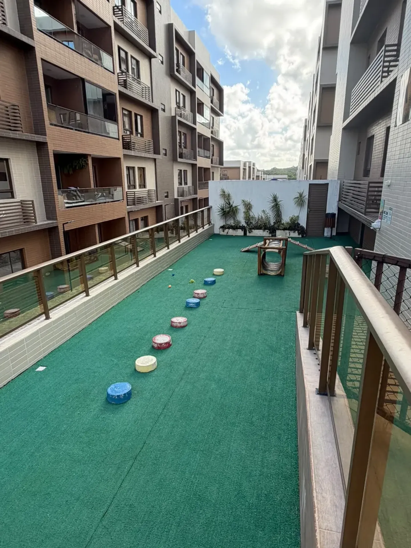 2-bedroom apartment in a building with a tennis court