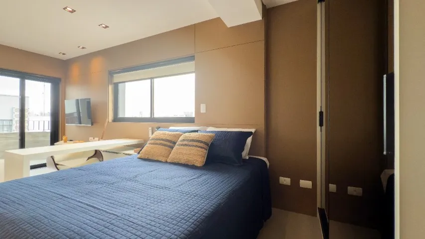 Furnished studio with open-plan kitchen and balcony — photo 14