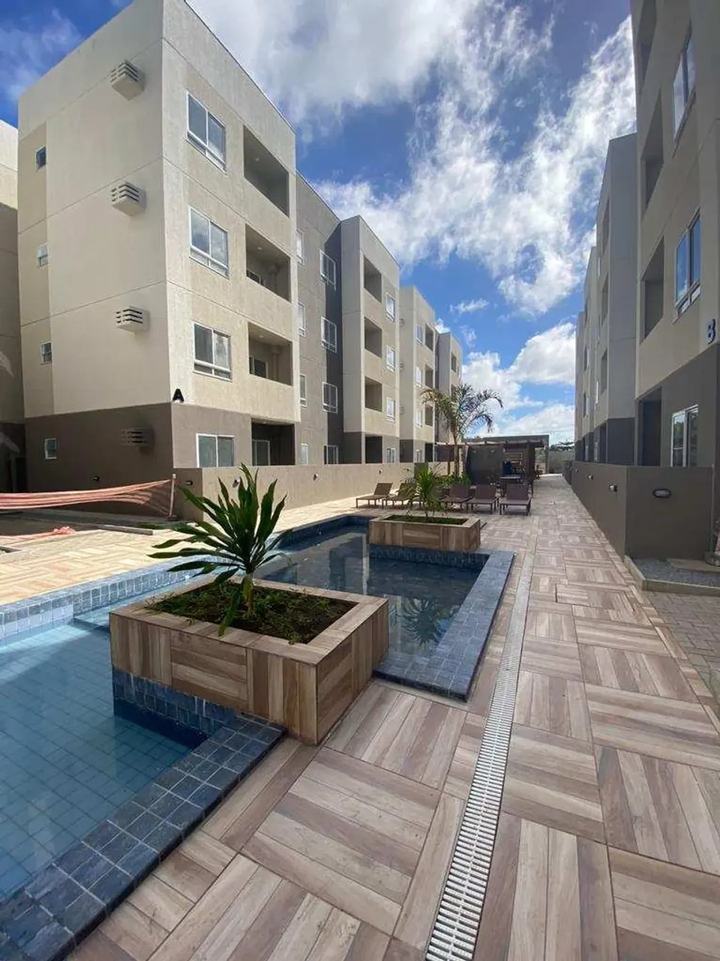 2-bedroom apartment in a building with a pool