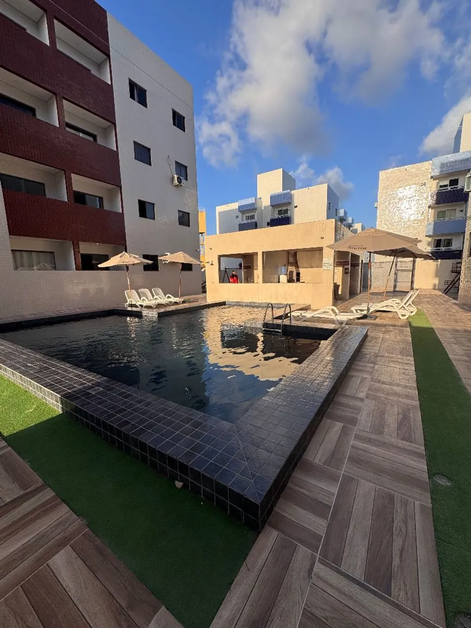2-bedroom apartment in a building with a pool — photo 5