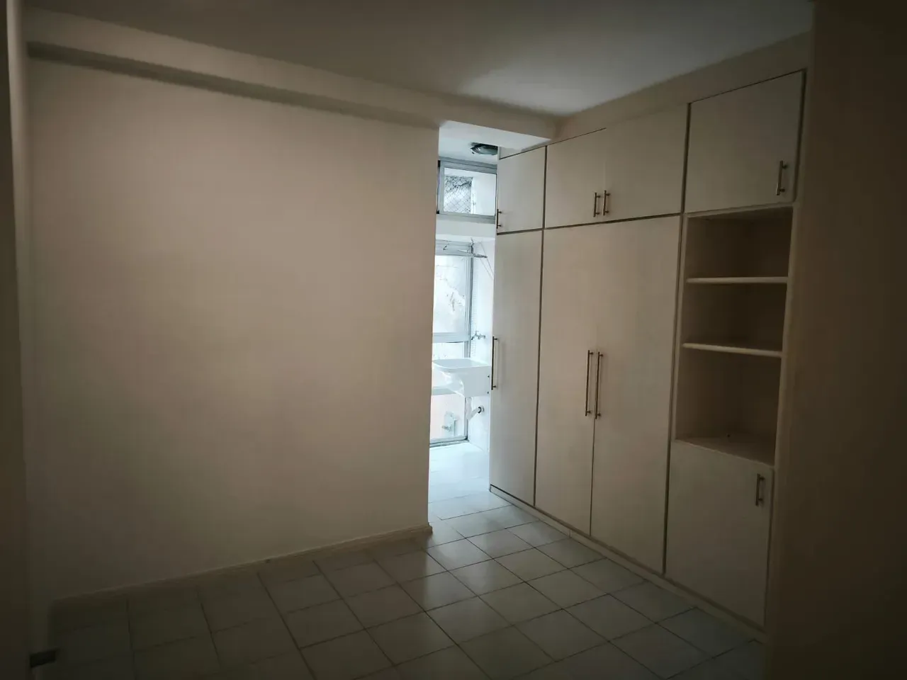 1-bedroom apartment with a closed kitchen and laundry area — photo 5