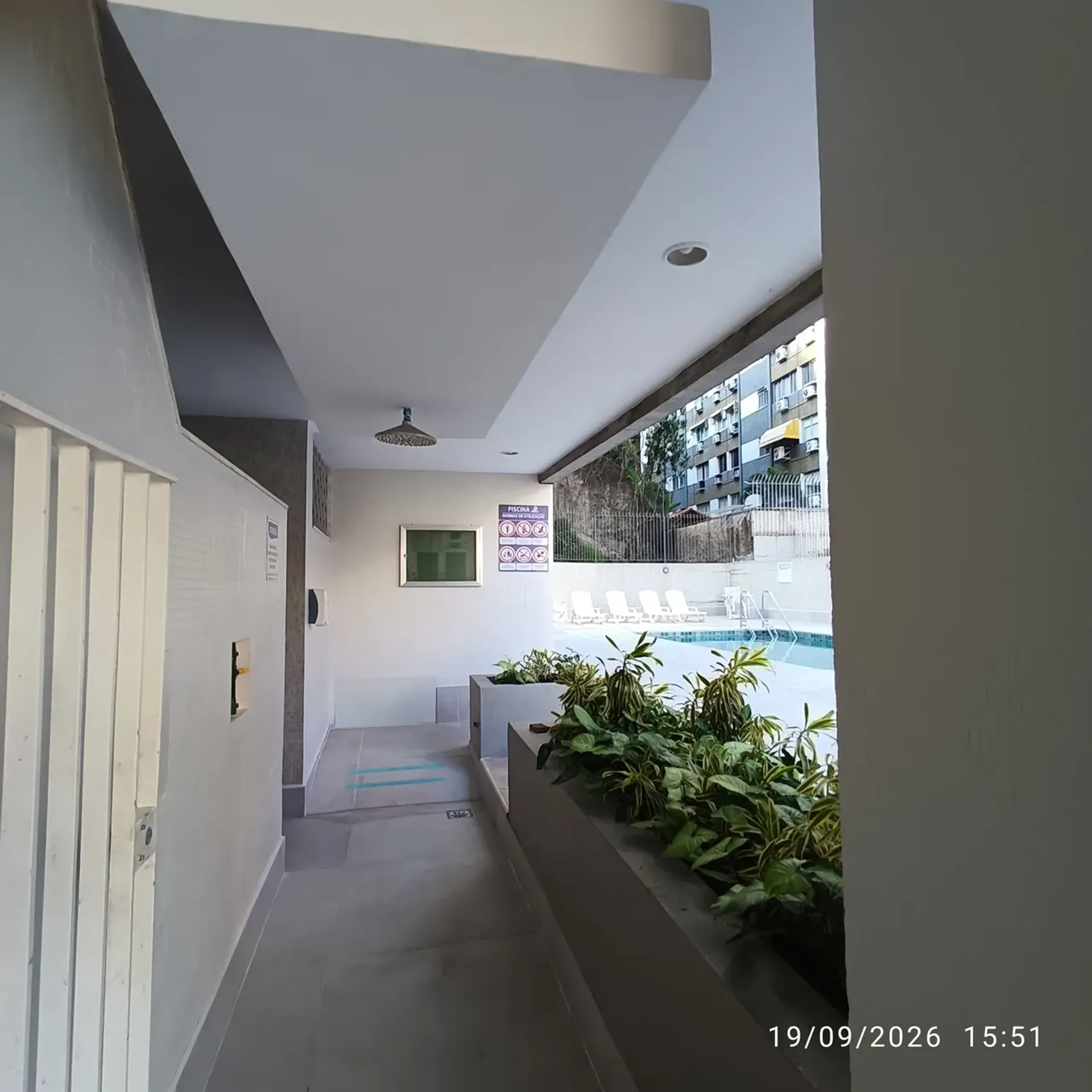 2-bedroom apartment in a building with a pool — photo 17