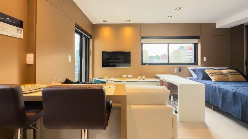 Furnished studio with open-plan kitchen and balcony — photo 19