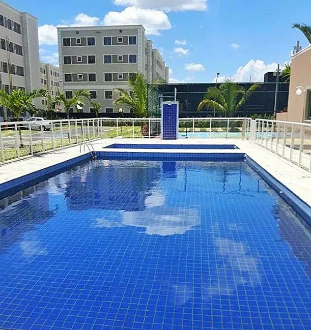 2-bedroom apartment in a building with a pool