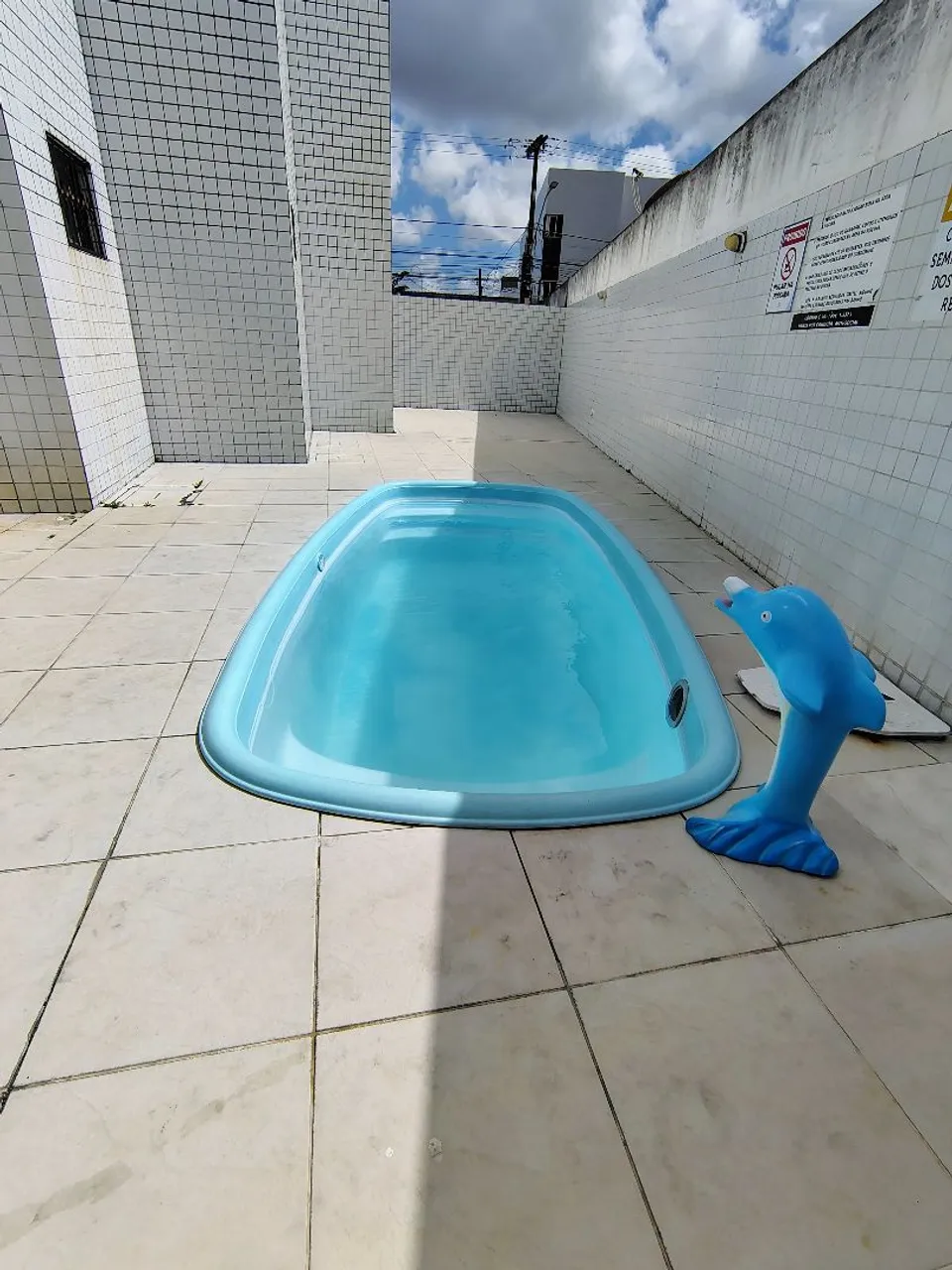 2-bedroom apartment in a building with a pool — photo 14