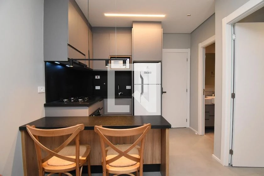 Furnished studio with open-plan kitchen and balcony