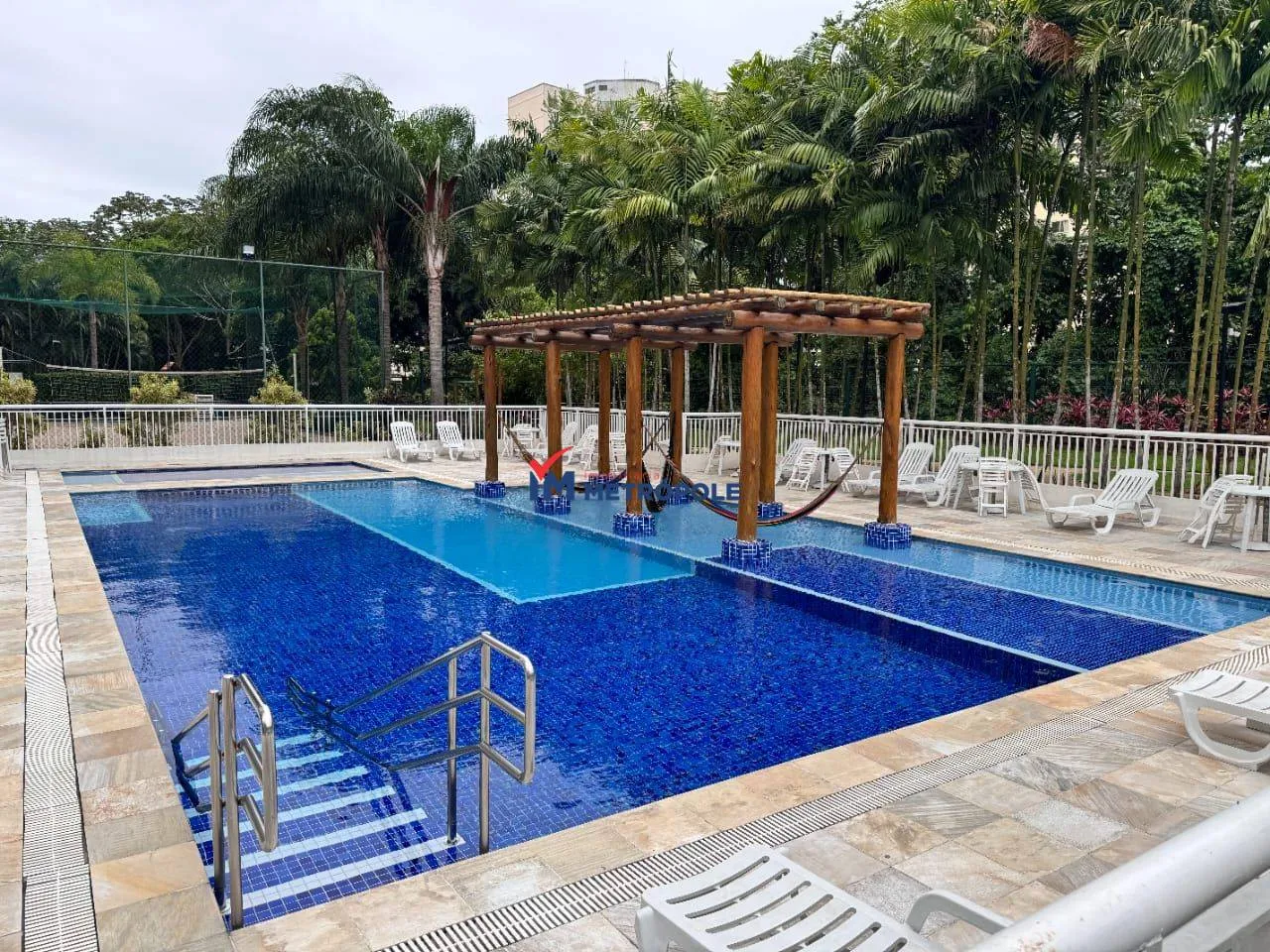2-bedroom apartment in a building with a pool — photo 8