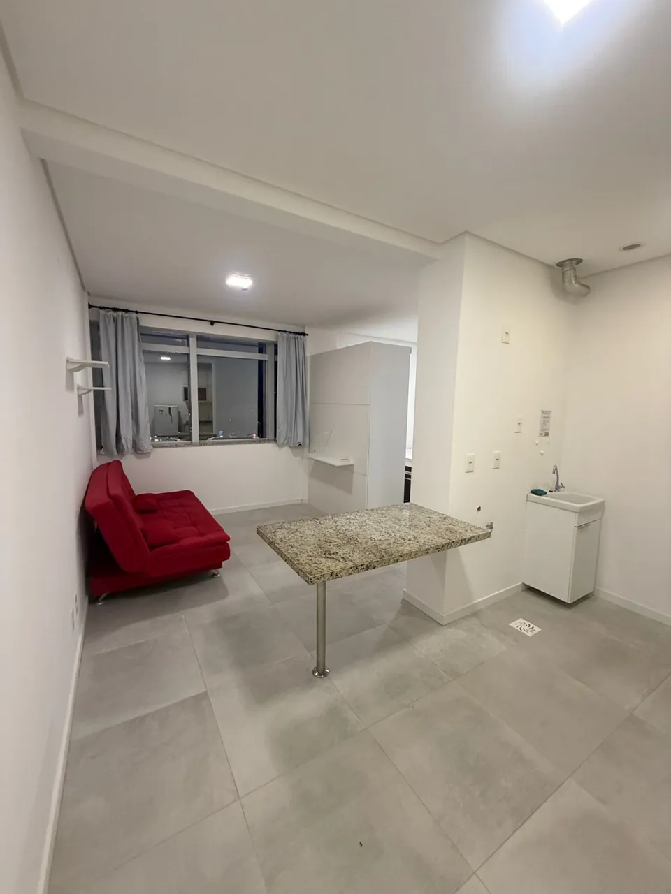 Furnished 1-bedroom apartment with balcony and laundry area